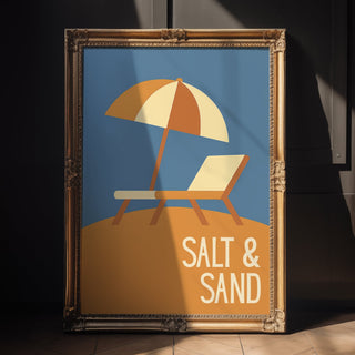 Framed artwork with a beach scene and 'Salt & Sand' text on a textured wall.