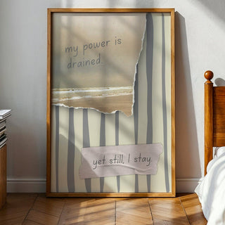 Framed artwork with text in a bedroom setting