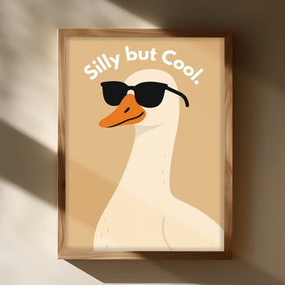 Framed artwork of a duck wearing sunglasses with 'Silly but Cool' text on a beige background.