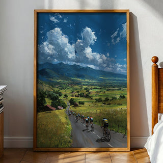 Framed painting of a scenic landscape with cyclists on a road in a bedroom setting.
