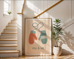 You & Me Mittens poster shown in an alternative frame style