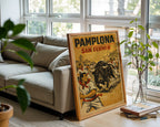 Pamplona San Fermín poster displayed in a cosy interior setting