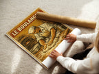 Le Boulanger poster displayed in a styled room setting