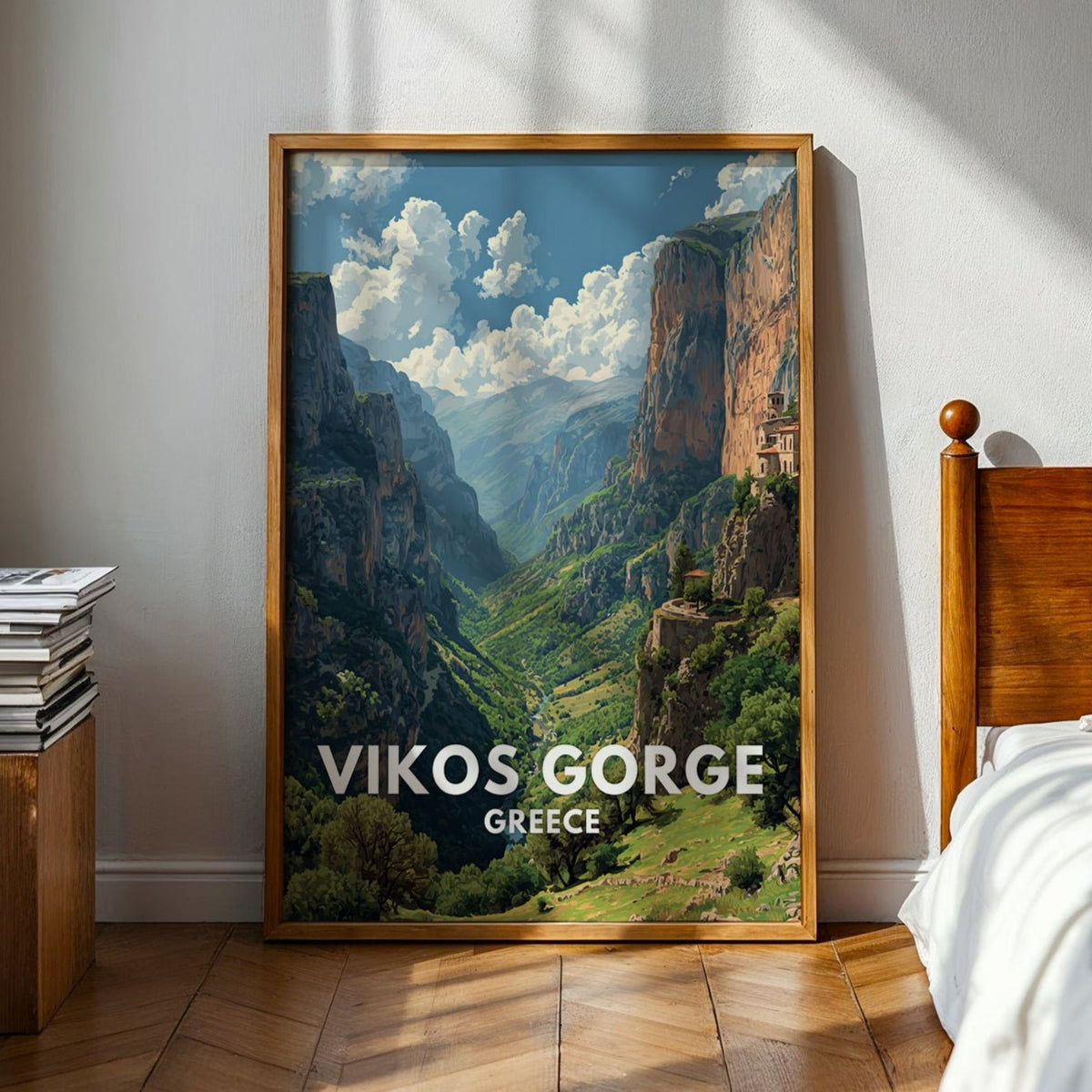 Framed picture of Vikos Gorge in Greece on a wall in a bedroom.