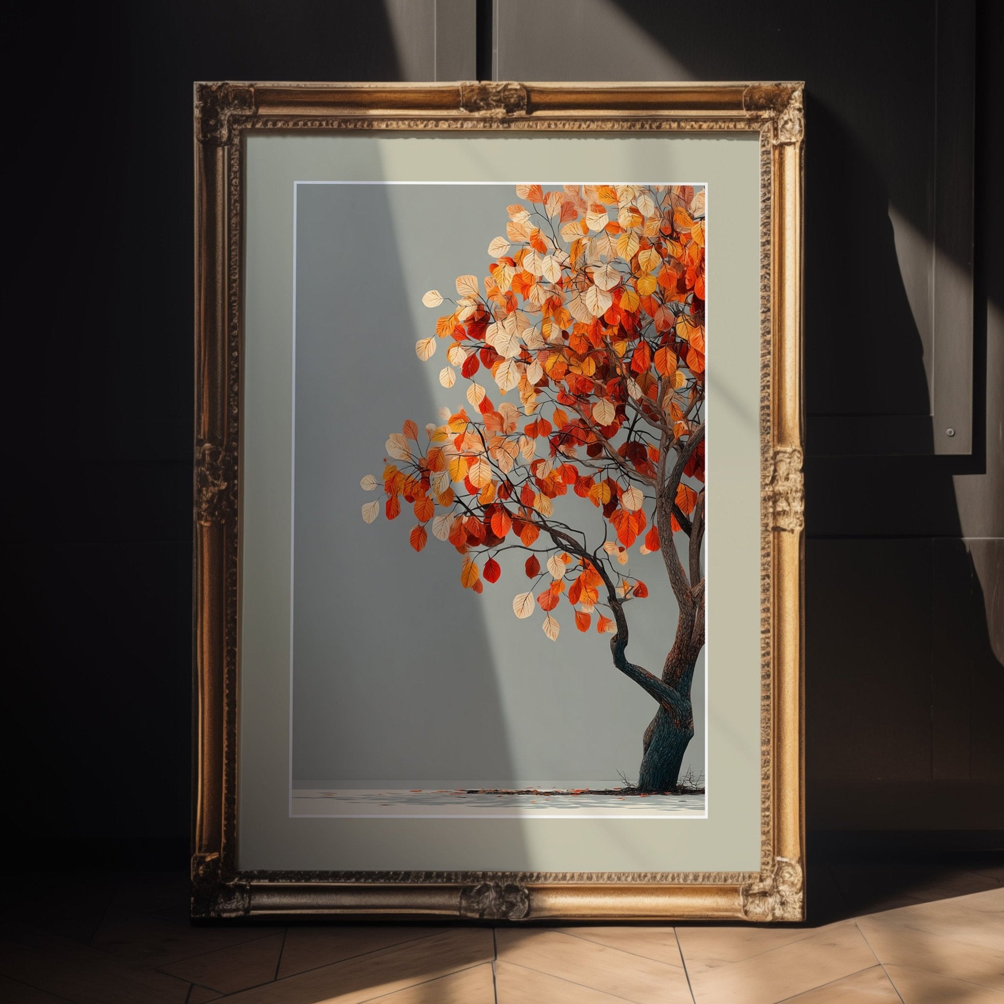 Framed artwork of a tree with autumn leaves on a wall.