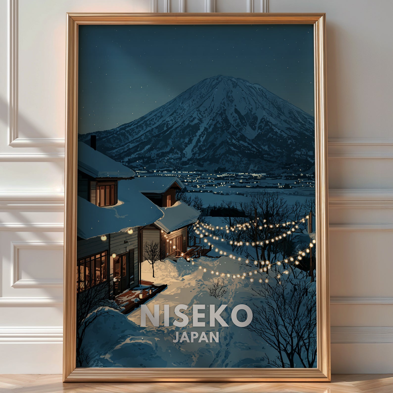 Illustrated 'Niseko Japan' poster of a snow-covered chalet strung with lights beneath a volcanic mountain at night