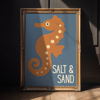 Framed artwork of a seahorse with 'Salt & Sand' text on a blue background

