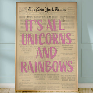 Framed newspaper with 'It's All Unicorns and Rainbows' text on a light blue wall.